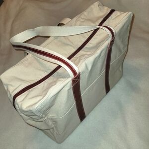 Large white canvas bag with red trim